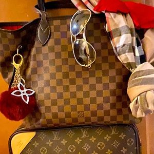 Louis Vuitton Neverfull GM handbag and $450 Louis Vuitton bag charm.